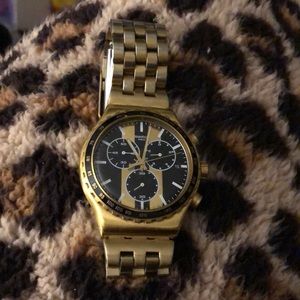 Men’s gold tone Swatch watch